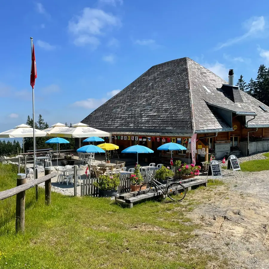 The Crau Rappo mountain inn and its terrace on a summer day
