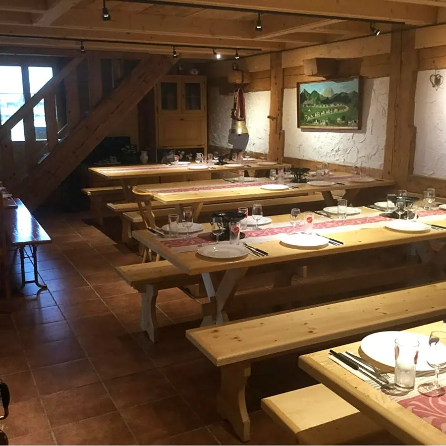 The inn's dining room, tables set for fondue